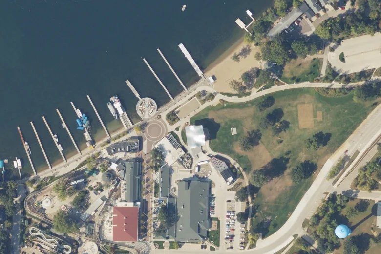 Aerial view of Iowa Great Lakes Maritime Museum’s shared building and lakefront visitor grounds at Arnolds Park, including docks and boardwalk, photographed in September 2025.